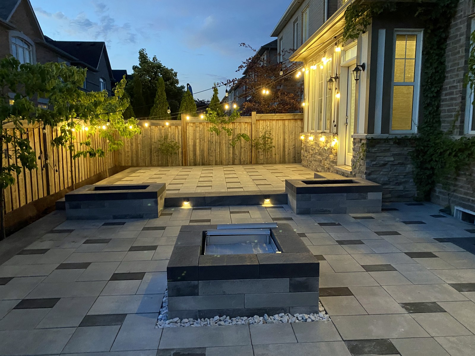 Patio illuminated by landscape lighting