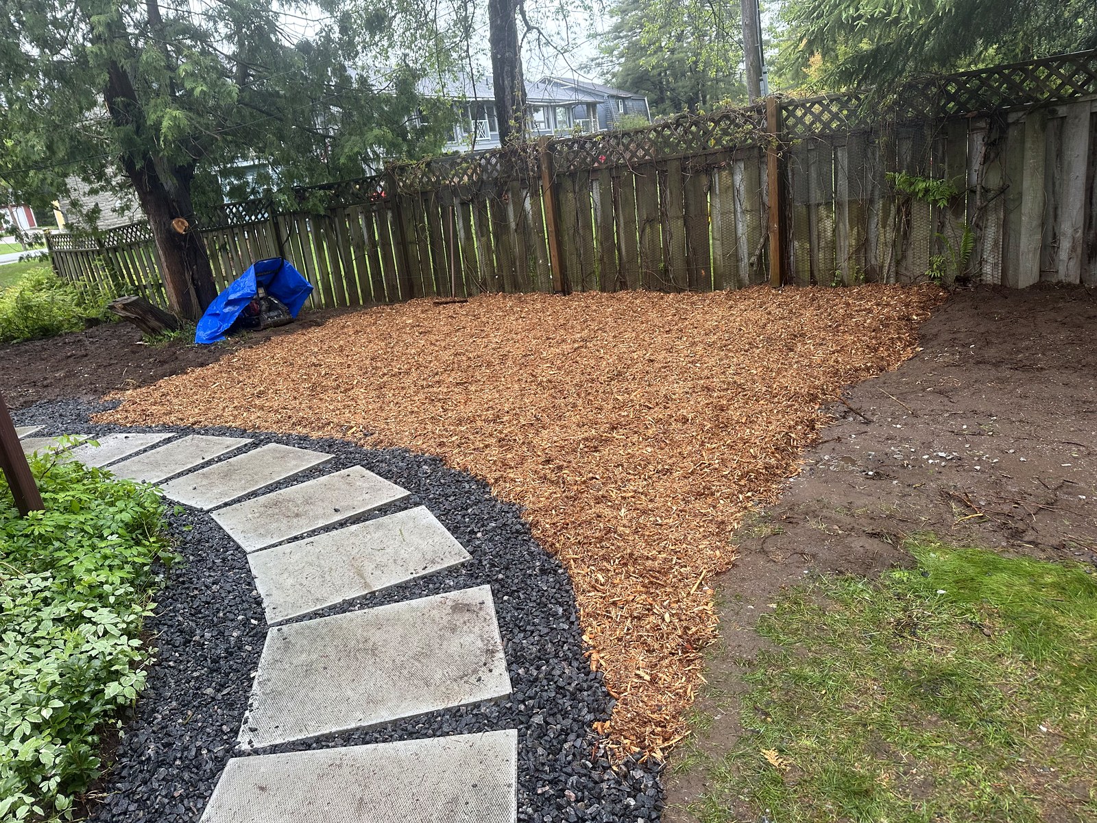 Curved stepping-stone path with dark aggregate